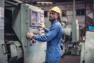 Technician adjusts and troubleshoots factory machinery for optimal performance and safety standard