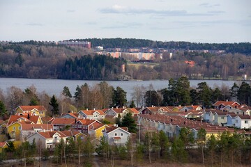 Homes with Pond. Scene of prime real estate community in Stockholm area. Living in serenity