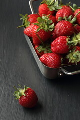Strawberry fruits on a black background