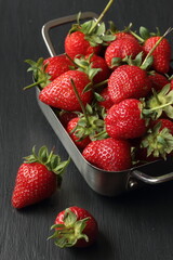 Strawberry fruits on a black background
