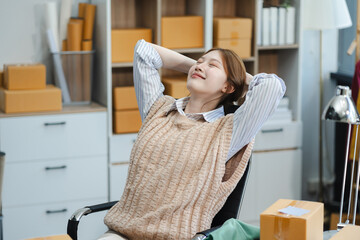 businesswoman sitting in office chair relaxing, female feeling peaceful resting at workplace.