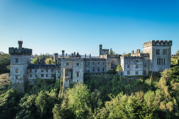 Fototapeta na wymiar Aerial view of Lismore Castle, County Waterford, Ireland, on a tranquil spring day under a flawless blue sky
