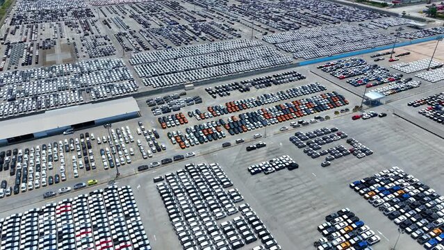 Behold the bird's-eye view of the automotive realm, where cars align flawlessly like soldiers in formation. This panorama epitomizes the disciplined approach prevalent in the industry.
