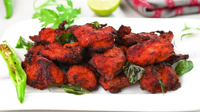 Serving chicken 65 dish in a plate.