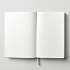 Open hardcover notebook with blank white pages on a subtle background
