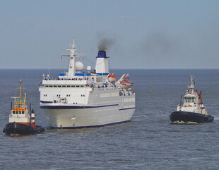 Small classic cruiseship cruise ship ocean liner Berlin arrival into Bremerhaven port, Germany with...