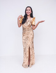 Elegant Filipino woman in gold Filipiniana dress presenting with enthusiasm