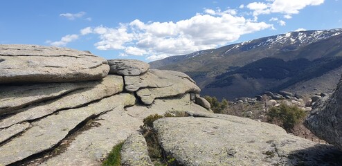 Stone formation in the background Sierra Béjar with snow