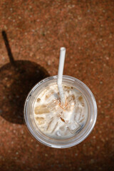 Iced cappuccino coffee with sunlight in summer season, Top view