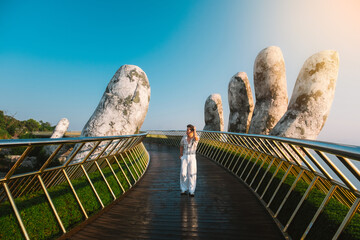 Traveler Walking on the Golden Bridge in Bana hills, enjoying the morning , Danang Vietnam