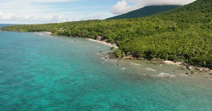 Tropical beach on Weh island and jungle. Tropical landscape. Aceh, Indonesia.