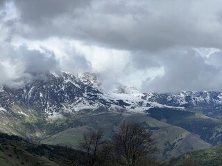 Tseylomsky pass in Ingushetia. A trip uphill to the Tsei Loam pass on a cloudy spring day. Panorama...
