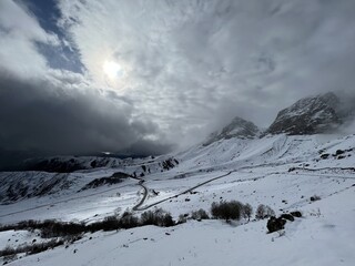 Tseylomsky pass in Ingushetia. A trip uphill to the Tsei Loam pass on a cloudy spring day. Panorama...