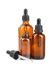 Glass bottles and pipette with tincture isolated on white