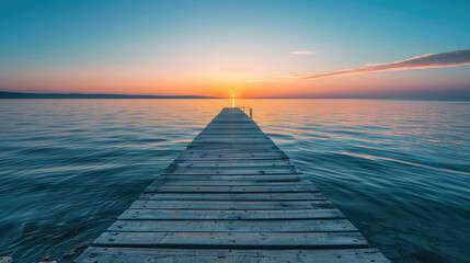 Wooden pier on the sea at sunset with beautiful sky, a long wooden path leads into the distance...