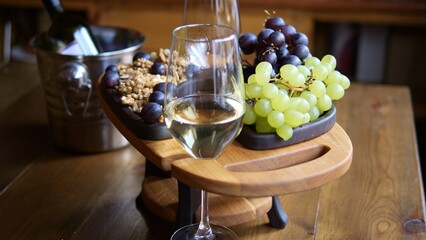 Glass of white wine sits elegantly against background of assorted fruits Wine with its fresh notes refreshing taste complements colors of fruit Wine aficionados will appreciate inviting appearance