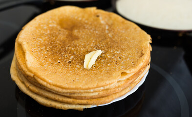 Cooking traditional pancakes from wheat flour in the kitchen - 790750383