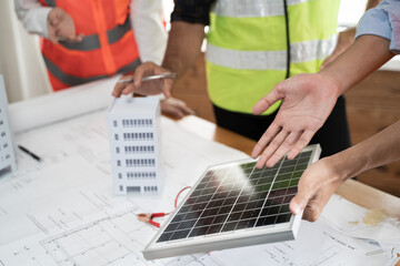 Engineer advise to use solar panels on the rooftop of the building, house as clean electric power green energy and reduce carbon zero waste environment - Powered by Adobe