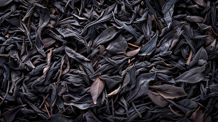 Black Darjeeling tea dried leaves background and texture