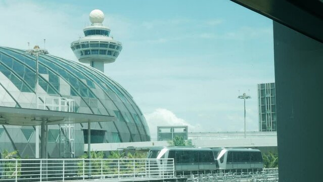 view outside the airport terminal building with air traffic control tower in summer holiday daytime
