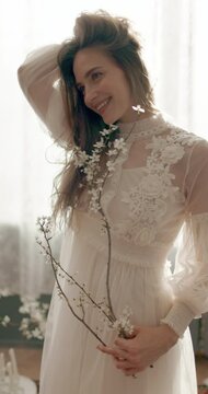 Portrait of beautiful smiling woman with natural flawless skin, wearing vintage style dress. Beauty concept
