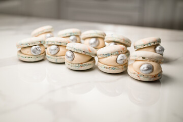 Beautiful macaroons, similar to shells, decorated with decorative edible pearls