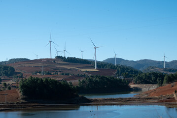  In Yangliu Village, Binchuan County, Dali, there is a grassland with windmills for generating wind...