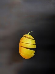 
sliced ​​orange fruit on black background