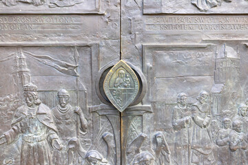 Szczecin Cathedral, decorative entrance door with a bronze door knocker, Szczecin, Poland - obrazy, fototapety, plakaty