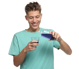 Young man with mouthwash on white background