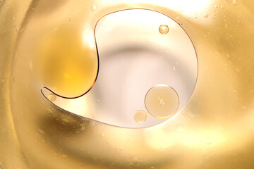 Macro close-up of oil droplets floating on water.