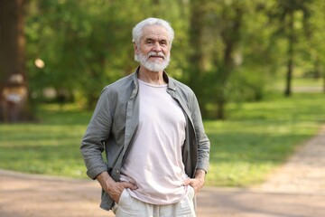 Portrait of happy grandpa in spring park