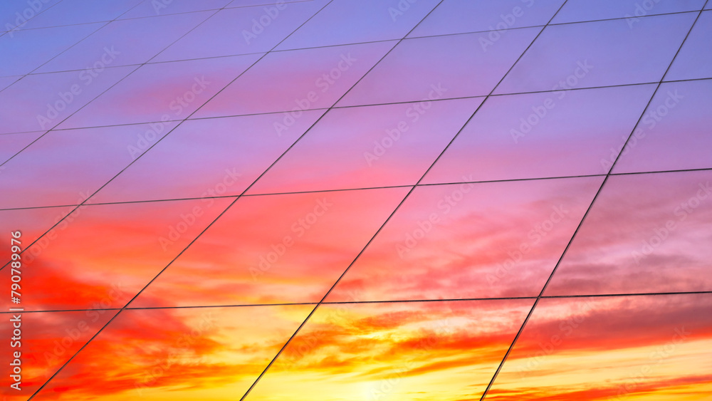 Poster web banner modern glass architecture with reflection of red and blue sunset sky. dramatic bright col