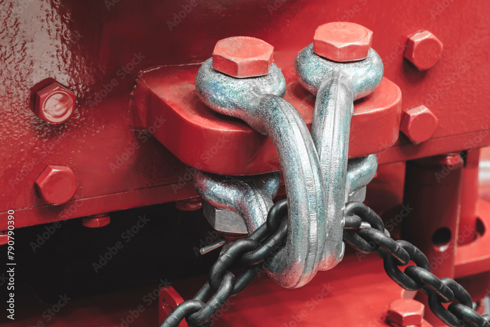 Poster A red object with a chain and a bolt on it