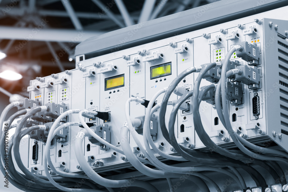 Poster A row of computer cables with a clock on the left side.