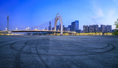 Asphalt road square and bridge with modern city buildings scenery at night in Guangzhou - obrazy, fototapety, plakaty