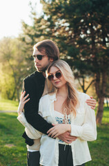 lovers in sunglasses in the park