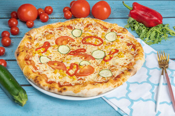 pizza with tomatoes and cheese