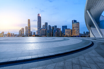 Round square floor and modern urban buildings at dusk in Guangzhou