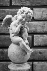 blac and white sculpture of angel