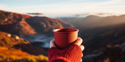 A girl holds a mug of hot drink, coffee, tea against the background of winter mountains in the camp. Generative AI.