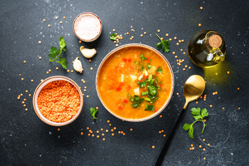 Red lentil soup, traditional arabic food with ingredients. Flat lay on black. - 790808753