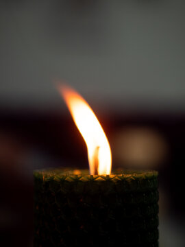 Warm ambiance of glowing wax candles casting flickering light in a serene setting, creating a cozy and inviting atmosphere for relaxation and contemplation. Rustic candlelight photography for interior