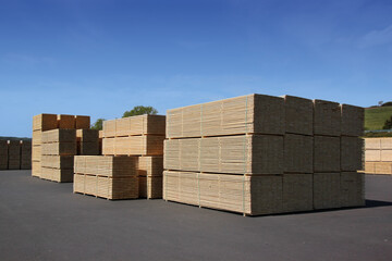 Stacks of timber boards on a sawmill storage area in Germany
