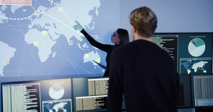 Cyber security team working in a Cyber Security Operations Center SOC to protect systems and technologies