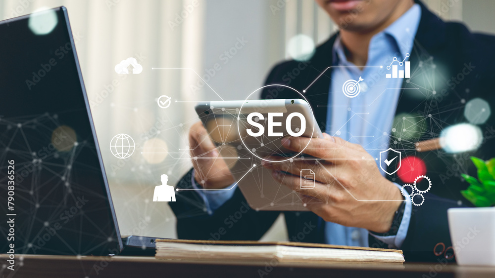 Wall mural businessman using a computer for analysis seo search engine optimization marketing ranking traffic w