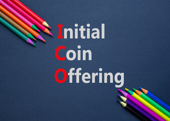 Fototapeta na wymiar ICO initial coin offering symbol. Concept words ICO initial coin offering on beautiful black paper. Beautiful black background. Colored pencils. Business ICO initial coin offering concept. Copy space.