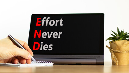 END effort never dies symbol. Concept words END effort never dies on beautiful black tablet....