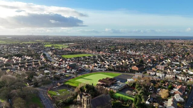 Aerial view of the Sacred Heart Church and the cityscape of Thornton, Lancashire, England, UK