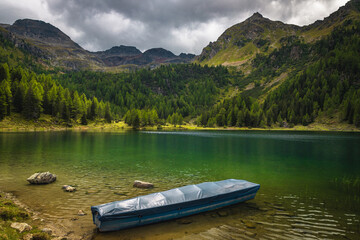 Moored boat on the lake in the mountains, Austria